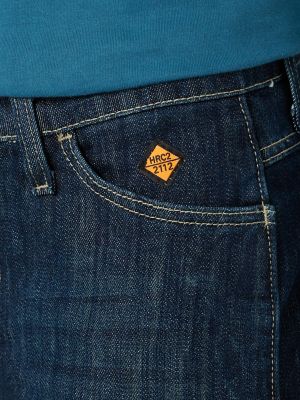 Women's Wrangler® FR Flame Resistant Mid-Rise Bootcut Jean in Rinse Wash