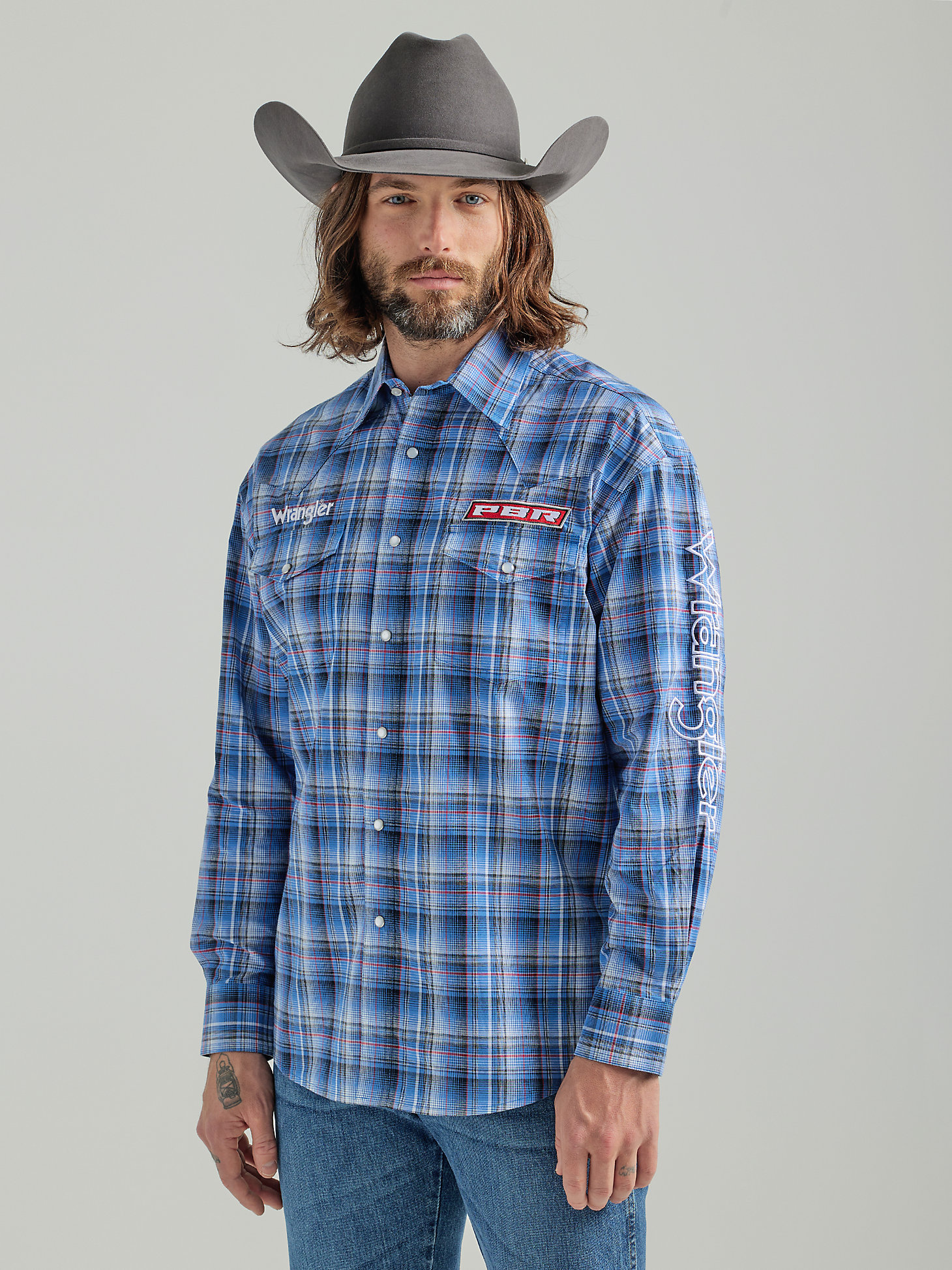 Men's PBR® Logo Long Sleeve Plaid Western Snap Shirt in Navy Blue main view